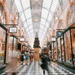 Shopping - person walking inside building near glass