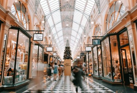 Shopping - person walking inside building near glass