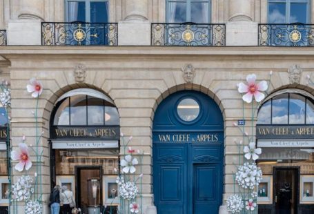 Luxury Shopping - A building with flowers on the front and blue doors