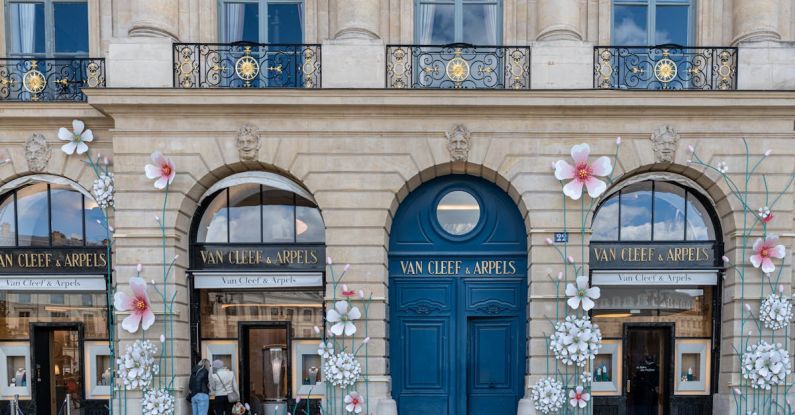 Luxury Shopping - A building with flowers on the front and blue doors
