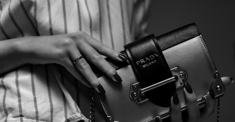 Luxury Shopping - black nikon dslr camera on white textile