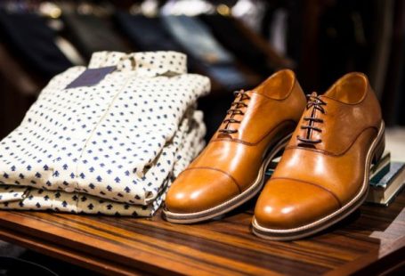 Luxury Shopping - Pair of Brown Leather Casual Shoes on Table