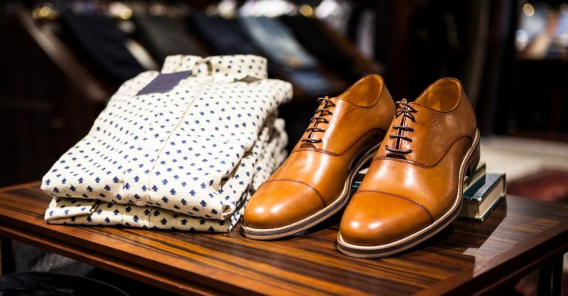 Luxury Shopping - Pair of Brown Leather Casual Shoes on Table