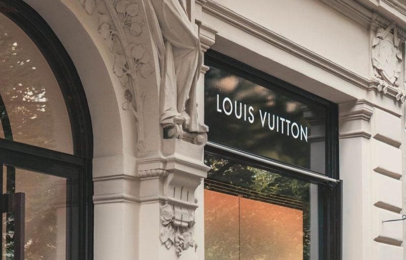 Luxury Shopping - Louis Vuitton boutique signage on building