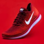 Footwear - unpaired red Nike sneaker