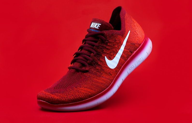 Footwear - unpaired red Nike sneaker