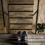 Footwear Industry - person standing near railing looking down