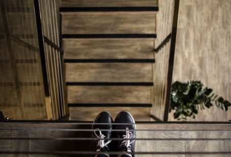 Footwear Industry - person standing near railing looking down