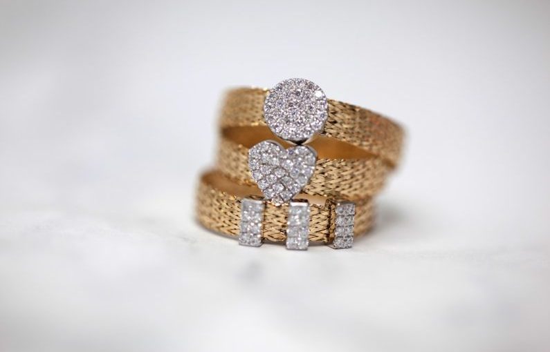 Jewelry - three gold-colored studded rings