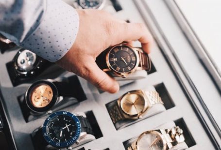 Watches - Person Holding Round Gold-colored Analog Watch With Link Bracelet