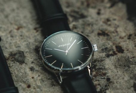 Watches - Photo of Two Analog Watches with Black Leather Bands on Gray Surface