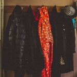 Coats - Hanged Black and Orange Coats Inside Room