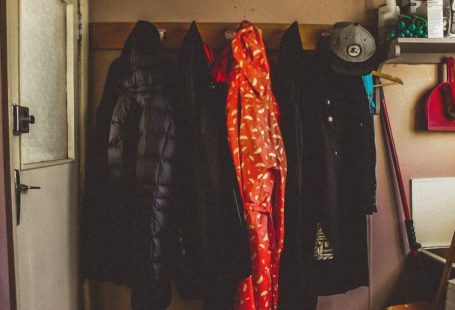 Coats - Hanged Black and Orange Coats Inside Room