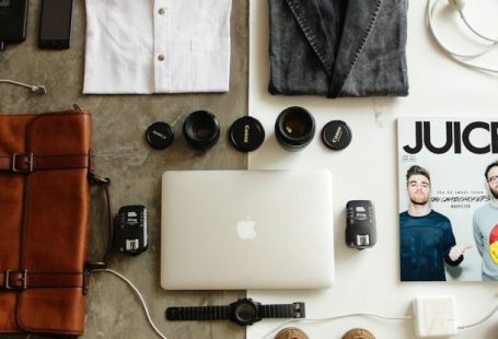 Essentials - Brown Leather Bag, Clothes, and Macbook