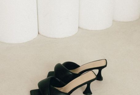Vegan Shoes - A pair of black heels on a white surface