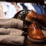 Leather Shoes - Pair of Brown Leather Wingtip Shoes Beside Gray Apparel on Wooden Surface